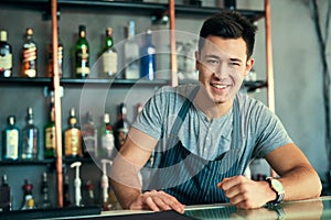 Happy, Asian and man as barista for portrait in restaurant, cafe and coffee shop for hospitality, food and fine dining