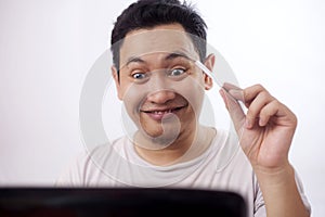 Happy Asian Man Making Online Purchase