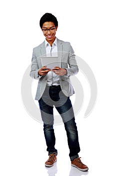 Happy asian man using tablet computer
