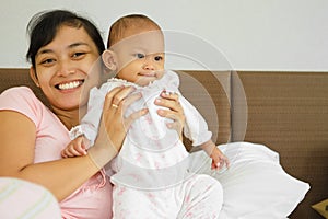 Happy Asian mother and baby