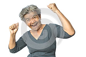 Happy Asian old woman smiling and joyful on white