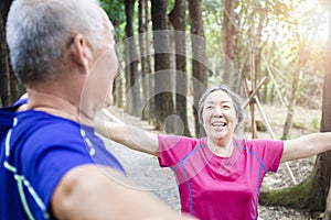Happy asian Senior  couple exercising in the park