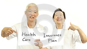 Happy Asian senior couple health care and insurance plan concept