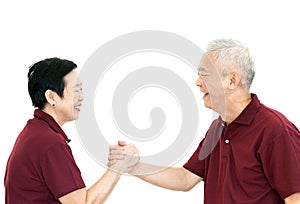 happy asian senior couple holding hands on white isolate background