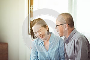 Happy asian senior couples encourage and hugging in bedroom together,Happy and smiling,Positive thinking,Adult social care concept