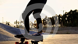 Happy Asian teen boy exercise surf skate at parking in her house