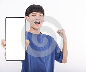 Happy Asian teenaher student holding smartphone mockup of blank screen