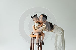 happy asian toddler girl sitting on