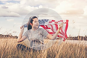 Happy asian woman with American flag USA celebrate 4th of July