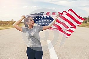 Happy asian woman with American flag USA celebrate 4th of July