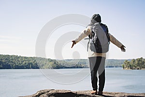 Happy Asian woman backpacker in nature winter season