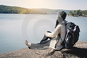 Happy Asian woman backpacker in nature winter season