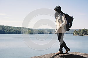 Happy Asian woman backpacker in nature winter season