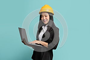 Happy Asian woman engineer and safety helmet with holding holding tablet computer, construction concept, Engineer, Industry