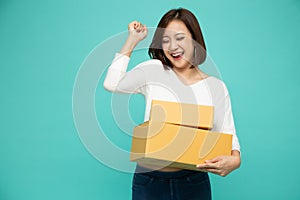 Happy Asian woman holding package parcel box,