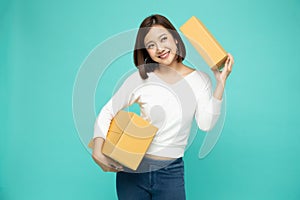 Happy Asian woman holding package parcel box,