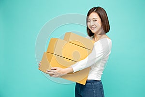 Happy Asian woman holding package parcel box.