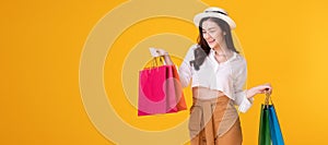 Happy asian woman holding shoppingbag with mid year sale