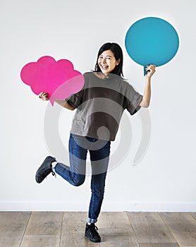 Happy Asian woman holding speech bubble