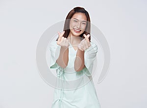 Happy asian woman patient showing heart isolated on white background. life insurance concept