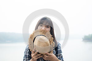 Happy Asian woman relaxing on holiday travel concept