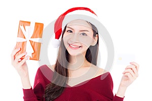 Happy asian woman with smile holding gift box and credit card of xmas