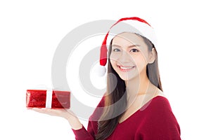 Happy asian woman with smile holding gift box of xmas