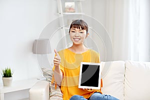 Happy asian woman with tablet pc and thumbs up