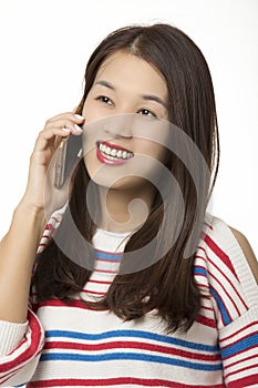 Happy Asian woman talking on smartphone isolated on white background