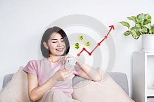 happy Asian woman using smartphone investment checking online stock market with growing business graph