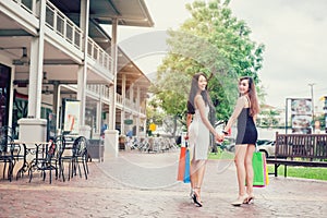 Happy Asian women friendship Enjoying Spending shopping bags in