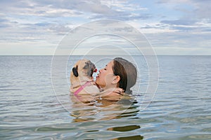 Happy Asian women girl hug play immersed in beach sea water