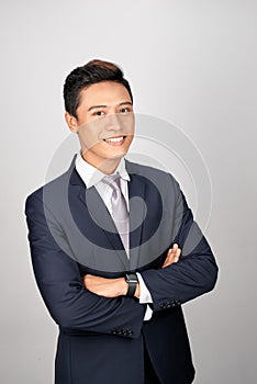 Happy Asian young businessman portrait, isolated on white background