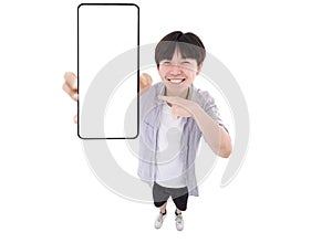 Happy Asian young man holding smartphone mockup of blank screen