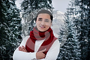 Happy asian young man with winter clothes