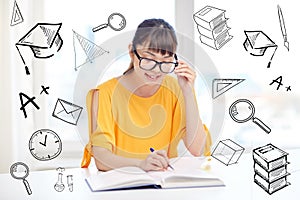 Happy asian young woman student learning at home