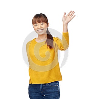 Happy asian young woman waving hand over white