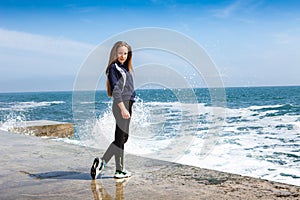 Happy Athletic girl on beach