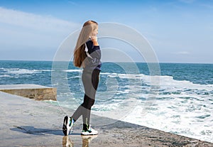 Happy Athletic girl on beach