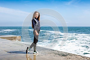 Happy Athletic girl on beach