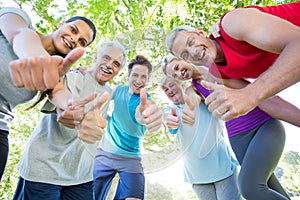 Happy athletic group with thumbs up