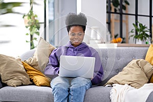 Happy attractive african american girl working office work remotely from home Black woman using laptop computer Distance