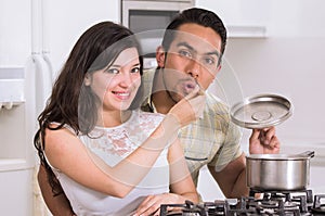 Happy attractive couple cooking together