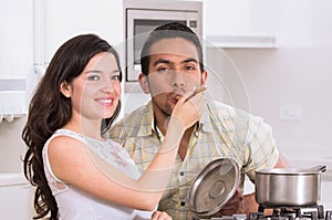 Happy attractive couple cooking together