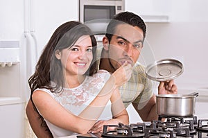 Happy attractive couple cooking together