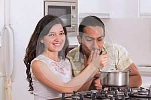 Happy attractive couple cooking together