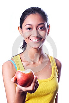 Happy attractive indian girl giving an apple