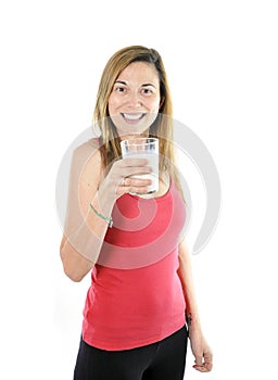 Happy attractive mature woman on her 40s drinking milk in health concept