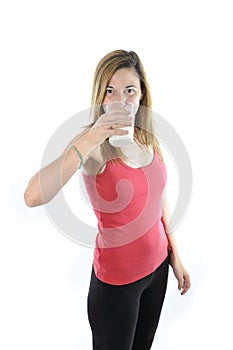 Happy attractive mature woman on her 40s drinking milk in health concept