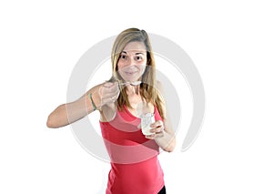 Happy attractive mature woman on her 40s eating yogurt in health concept